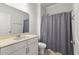 Clean bathroom features a white vanity, large mirror, and a shower-tub combination with a curtain at 2688 Jacana Ct, Mount Pleasant, SC 29466