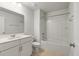 Clean bathroom with a single vanity, large mirror, and a shower-tub combination with a white surround at 2688 Jacana Ct, Mount Pleasant, SC 29466