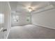 Empty bedroom featuring plush carpeting, a ceiling fan, and large windows for ample light at 2688 Jacana Ct, Mount Pleasant, SC 29466