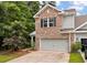 Beautiful home featuring brick, siding, a two-car garage, and professionally landscaped front yard at 2688 Jacana Ct, Mount Pleasant, SC 29466