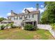 Exterior view of home from the backyard showcases the patio, landscaping, and fencing at 2688 Jacana Ct, Mount Pleasant, SC 29466