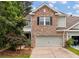 Beautiful home featuring brick, siding, a two-car garage, and professionally landscaped front yard at 2688 Jacana Ct, Mount Pleasant, SC 29466