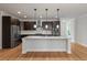 Modern kitchen featuring an island, stainless steel appliances, granite countertops, and ample cabinet space at 2688 Jacana Ct, Mount Pleasant, SC 29466