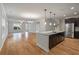 Open kitchen featuring dark cabinets, stainless steel appliances, granite counters, and a center island at 2688 Jacana Ct, Mount Pleasant, SC 29466