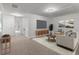 Bright, neutral living room features stylish furniture, carpet, and a modern entertainment center at 2688 Jacana Ct, Mount Pleasant, SC 29466