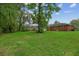Lush backyard of a home featuring a beautiful lawn and mature shade trees at 2708 Mawood Ave, North Charleston, SC 29406