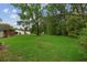 Expansive backyard with a well maintained lawn, with home in the background at 2708 Mawood Ave, North Charleston, SC 29406