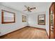 Bright bedroom with three windows, hardwood floors and neutral paint at 2708 Mawood Ave, North Charleston, SC 29406