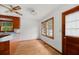 Eat-in kitchen area offers wooden floors, cabinets, and natural light at 2708 Mawood Ave, North Charleston, SC 29406