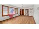 Spacious living room featuring beautiful hardwood floors and large windows at 2708 Mawood Ave, North Charleston, SC 29406