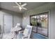 Outdoor balcony seating area and sliding door offers panoramic views of lush landscape and trees at 291 Sea Cloud Cir, Edisto Beach, SC 29438