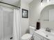 Bathroom features a shower, toilet, framed picture, and white vanity with a sink at 291 Sea Cloud Cir, Edisto Beach, SC 29438