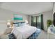 Cozy bedroom with modern decor and sliding glass door to balcony at 291 Sea Cloud Cir, Edisto Beach, SC 29438