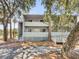 Exterior of home with wooden siding and walkway leading to the entrance at 291 Sea Cloud Cir, Edisto Beach, SC 29438