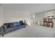 Open-concept living room featuring a couch, breakfast bar, and views of the kitchen area at 291 Sea Cloud Cir, Edisto Beach, SC 29438