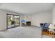 Spacious living room with a sliding glass door to balcony, fireplace, and comfortable furniture at 291 Sea Cloud Cir, Edisto Beach, SC 29438