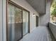 Covered patio features wood flooring with sliding glass door and lighting at 291 Sea Cloud Cir, Edisto Beach, SC 29438