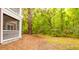 Landscaped backyard with screened porch and wooded views at 300 Bucksley Ln # 102, Charleston, SC 29492