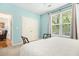 Bedroom featuring blue walls, a large window, and a closet at 300 Bucksley Ln # 102, Charleston, SC 29492