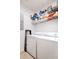 Bright laundry room featuring a washer, dryer and overhead wire shelving for storage at 300 Bucksley Ln # 102, Charleston, SC 29492