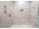 Walk-in shower featuring neutral tile, a niche, and grab bar at 300 Bucksley Ln # 102, Charleston, SC 29492