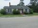 Charming single-story home with gray siding, a quaint porch, and well-manicured landscaping at 301 Ridge St, Saint George, SC 29477