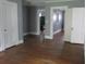 Neutral living space with an open floor plan and rich hardwood floors, ready for personalization at 301 Ridge St, Saint George, SC 29477
