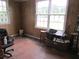 Cozy room filled with furniture and an array of windows at 301 Ridge St, Saint George, SC 29477
