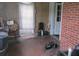 Enclosed sunroom featuring wood paneled walls, tile floor, and access to the exterior and interior of the home at 301 Ridge St, Saint George, SC 29477