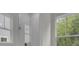 Bright bathroom with glass enclosed shower and large windows at 3027 Robeson Trce, Johns Island, SC 29455