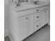 Bathroom vanity boasts white cabinets, quartz countertops and double sinks at 3027 Robeson Trce, Johns Island, SC 29455