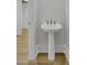Elegant pedestal sink with modern fixtures in a neutral-toned bathroom at 3027 Robeson Trce, Johns Island, SC 29455