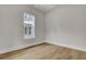 Bright bedroom with hardwood flooring and a large window at 3027 Robeson Trce, Johns Island, SC 29455