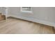 Bright bedroom with hardwood flooring and a large window and entry doors at 3027 Robeson Trce, Johns Island, SC 29455