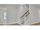 Entryway with staircase featuring wood handrail and white risers at 3027 Robeson Trce, Johns Island, SC 29455