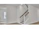 Entryway with staircase featuring wood handrail and white risers at 3027 Robeson Trce, Johns Island, SC 29455