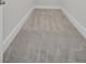 Narrow hallway featuring light-colored carpet and white base trim at 3027 Robeson Trce, Johns Island, SC 29455