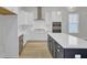 Modern kitchen with stainless steel appliances, a white countertop island, and ample cabinet space at 3027 Robeson Trce, Johns Island, SC 29455
