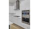 Bright kitchen features stainless steel appliances, white cabinets, and gas cooktop at 3027 Robeson Trce, Johns Island, SC 29455
