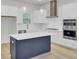 Bright kitchen featuring a large island, stainless appliances, and modern pendant lighting at 3027 Robeson Trce, Johns Island, SC 29455