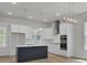 Modern kitchen with island, stainless steel appliances, white cabinets, and stylish lighting at 3027 Robeson Trce, Johns Island, SC 29455