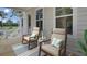 Relaxing porch with seating area, wooden floors, decorative pillows, and calming color scheme at 3027 Robeson Trce, Johns Island, SC 29455