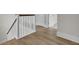 Staircase featuring hardwood flooring, white railings, and natural light, creating an inviting atmosphere at 3027 Robeson Trce, Johns Island, SC 29455