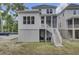 Charming two-story home with a screened-in porch, stairs leading to the backyard, and a glimpse of the patio at 3041 Robeson Trce, Johns Island, SC 29455