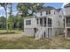 A beautiful two-story home with a charming screened-in porch and a staircase leading to the backyard at 3041 Robeson Trce, Johns Island, SC 29455