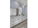 Bright bathroom with dual sinks, white cabinets, and neutral tile at 3041 Robeson Trce, Johns Island, SC 29455