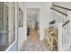 Bright and airy entryway leading to a modern interior with stylish decor and staircase at 3041 Robeson Trce, Johns Island, SC 29455