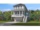 Charming two-story home with a welcoming porch, garage, and beautifully landscaped yard at 3041 Robeson Trce, Johns Island, SC 29455