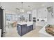 Open-concept kitchen with an island, stainless steel appliances, and seamless connection to the dining area at 3041 Robeson Trce, Johns Island, SC 29455