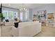 Bright and airy living room with comfortable seating, large windows, and stylish decor at 3041 Robeson Trce, Johns Island, SC 29455